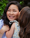 Esther and her daughter hugging and smiling